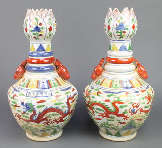 A pair of 18th Century style Chinese tulip vases with deer handles the octagonal bodies decorated with dragons 15" 
