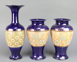 A pair of Doulton Slaters oviform vases, the dark blue ground with a band of flowers, a single ditto with waisted neck 14 1/2" 