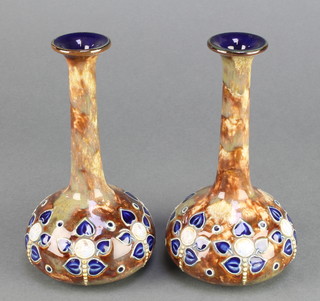 A pair of Royal Doulton baluster vases with elongated necks and floral decoration 6 1/2" 