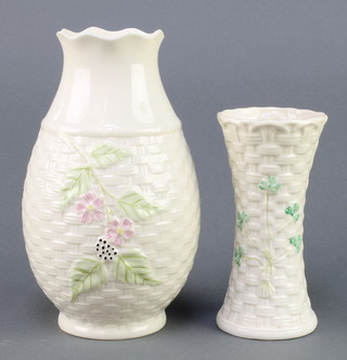 A Belleek waisted basket pattern vase with clover decoration 5 1/2" having black mark, a baluster ditto having a brown mark 8" 
