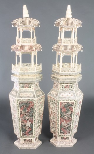 A pair of stained bone pagodas with hexagonal shaped bases decorated with panels of dragons and flowers 29" 