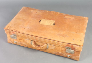 A brown leather suitcase with chrome mounts 9" x 30"w x 16"d, bears old Southern Railways label 