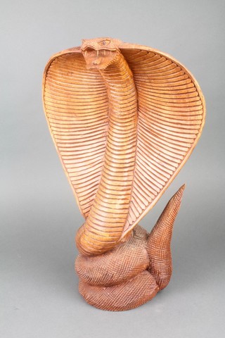 A carved wooden figure of a cobra's head 18" 