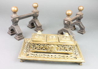 A 19th Century rectangular pierced brass standish fitted stamp box flanked by 2 inkwells with hinged lids, raised on bracket feet 3" x 11" x 6 1/2"
