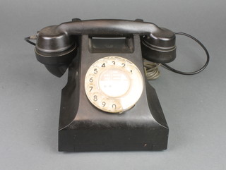 A black dial telephone marked AEP, base marked 621