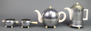 An Everhot 4 piece tea service with chrome cosies comprising teapot, hotwater jug, twin handled sugar bowl and cream jug