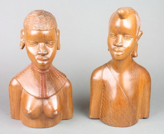 A pair of African carved hardwood portrait busts of a lady and gentleman 13" 