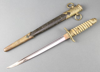 An Imperial Japanese World War Two naval Dirk having a 9" blade and shagreen grip, complete with lacquered scabbard 
