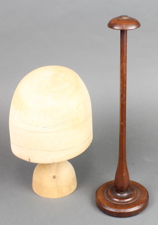 A turned wooden hat form 11" together with a turned mahogany hat display stand 16" 