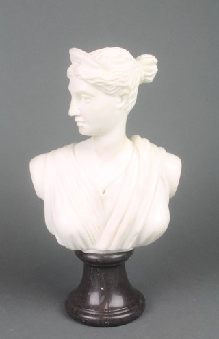 A carved marble head and shoulders portrait bust of a classical lady raised on a turned socle base 12" 