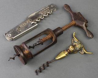 A Plat's Wulfruna cork screw, the handle in the form of a buffalo's head, a Waiters Friend corkscrew marked Hugsen German wines 