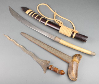 A Kris with 11" blade together with 1 other Eastern dagger with 7" crescent shaped blade and bamboo scabbard