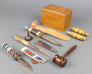A turned rosewood gavel, a German Bowie knife with 5" blade, 2 daggers, a pair of cricketing bales and an oak table top card index box 