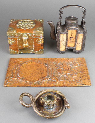 A bronze chamber stick decorated a serpent 4", a rectangular embossed copper plaque with floral decoration 11" x 5 1/2", A Chinese hardwood card box the interior fitted 4 sections with brass mounts 4" x 5" x 4" and a reproduction Chinese kettle 