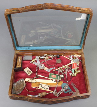 A table top display cabinet containing various curios 3" x 16" x 11 1/2" 