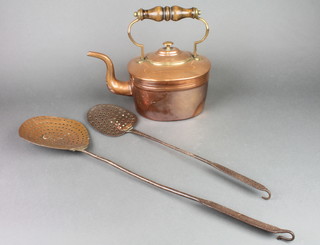 An oval copper kettle with turned wooden handle 11" together with 2 brass and iron long handled spatulars  