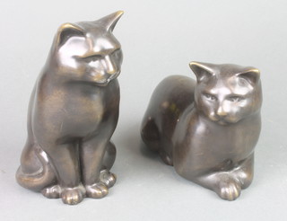 A bronze figure of a recumbent cat 5" and a ditto seated 7" 