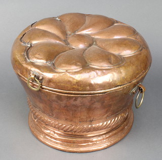 A circular Continental embossed copper coal box the hinged lid in the form of a flower head 10" x 14" diam. 