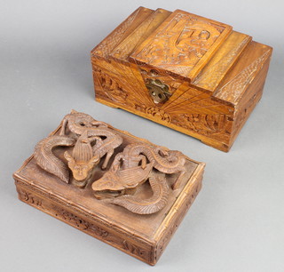 A Chinese deeply carved trinket box with hinged lid decorated mythical beasts 4" x 10" x 7" together with a camphor box with stepped lid 5" x 11" x 7" 