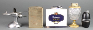 A vintage chrome table lighter in  the form of an aircraft 5 1/2", The Decca Navigator lighter, a large Zippo style lighter, a Marlborough promotional lighter and 1other lighter 