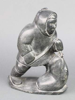 A large carved hardstone Inuit figure of a fisherman 9" 
