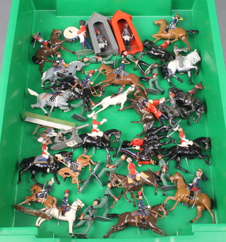A collection of Britains toy soldiers including Hussars and various lead figures of rifleman 