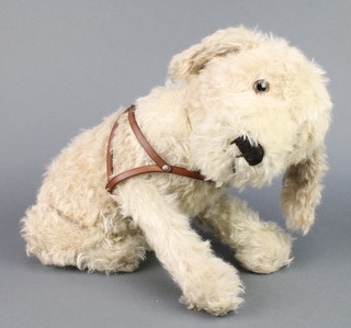 A "Farnell" seated figure of a dog with harness 12" 