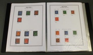 An album of mint and used George VI GB stamps 1936-1952 and various stamped envelopes