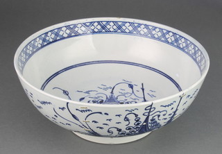 An 18th Century Delft blue and white bowl decorated with garden views 9" 
