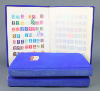 3 blue plush stock books of mint and used GB and Iranian stamps 