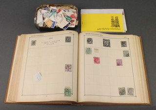 A school boy album of various World stamps, a tin of World stamps etc 
