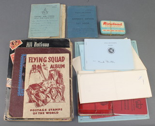 4 school boy albums of world stamps, a Royal Air Force airman's service and pay book and other items of ephemera