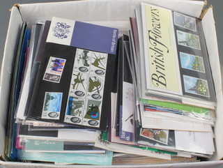 A box containing various Elizabeth II GB presentation stamps and first day covers