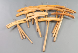 16 various Edwardian shaped beech coat hangers 