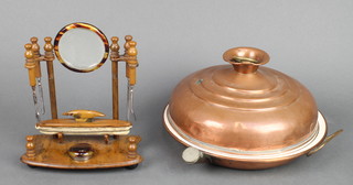 A circular copper foot warmer 8 1/2", a plate warmer 8" and a manicure set 