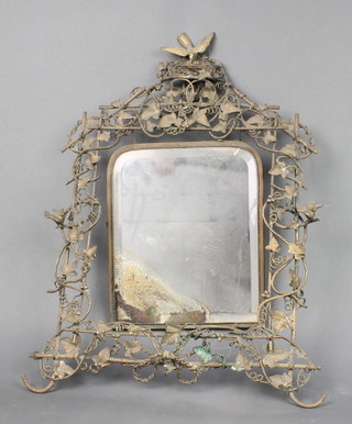 A Victorian arched plate mirror contained in a pierced gilt metal frame surmounted by a figure of a bird and nest 21" x 14" 