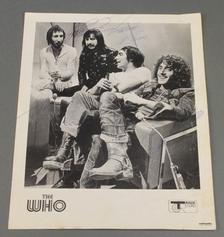A black and white signed photograph of The Who, some creasing 
