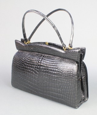 A lady's black crocodile handbag by D Exklusiv  9"h x 13"w x 4 1/2"d 