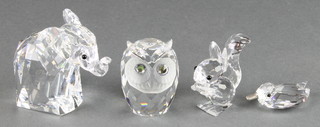 A Swarovski figure of a standing elephant 2 1/2", an owl, squirrel and bird