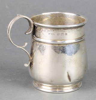 A silver bulbous mug with engraved monogram Birmingham 1929, 75 grams 