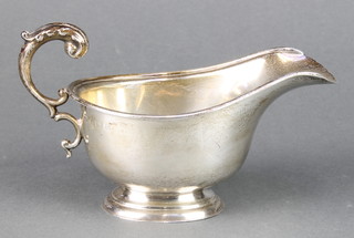 A silver sauce boat with S scroll handle Birmingham 1940
