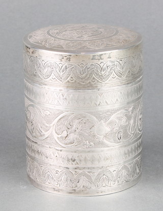 An Indian silver circular lidded box with chased floral decoration 5", 142 grams