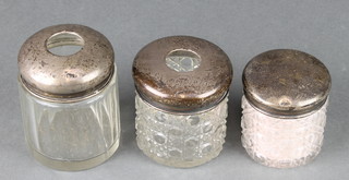 An Edwardian silver and cut glass hair tidy, 1 other and a lidded jar 