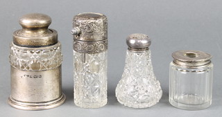 A cut glass toilet jar with silver mounted stopper and base Birmingham 1900 and 3 others