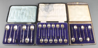 A cased set of 6 silver bean end coffee spoons Birmingham 1922, a cased set of 6 silver apostle spoons and nips Sheffield 1920, 100 grams and a cased set of 12 silver bean end coffee spoons Sheffield 1929 