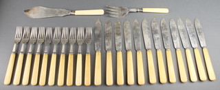 A set of silver bladed fish eaters comprising a pair of fisher servers, 12 knives and 10 forks, Sheffield 1910