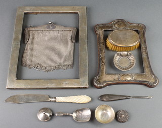A silver butter dish with mother of pearl handle, photograph frames and minor items 