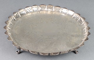 A Victorian silver salver with pierced and cut rim and chased scroll decoration London 1872 10", 538 grams
