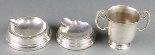 A silver 2 handled trophy Birmingham 1932 3", 118 grams together with 2 silver table ashtrays 