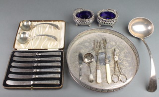 A pair of pierced silver plated mustards with swing handles and other plated items
